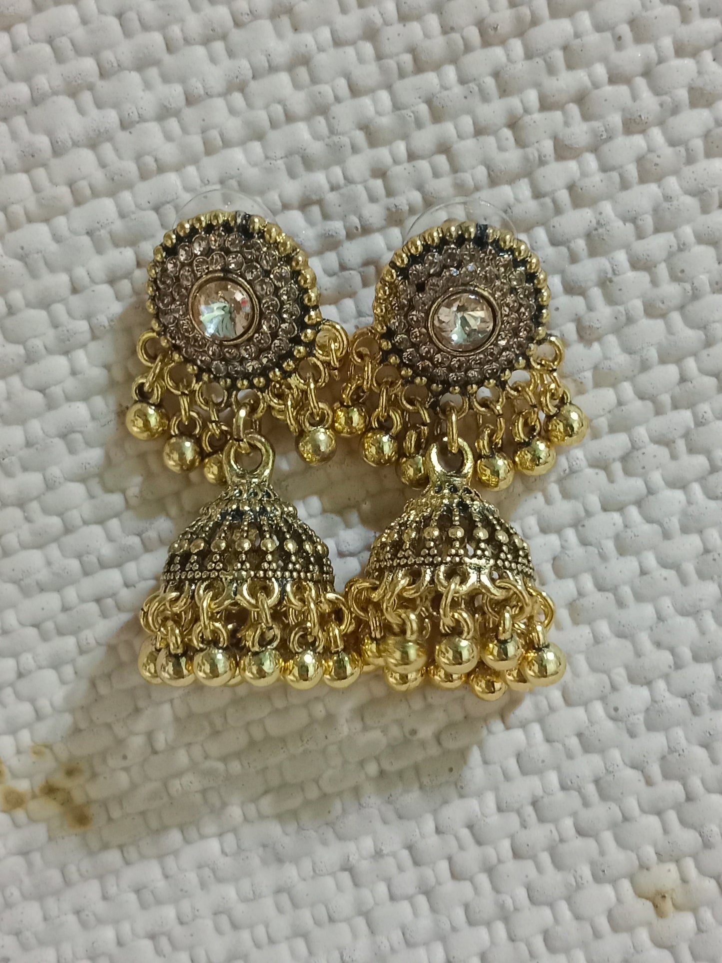 Golden Traditional Jhumka Earrings with Stone Studded Design